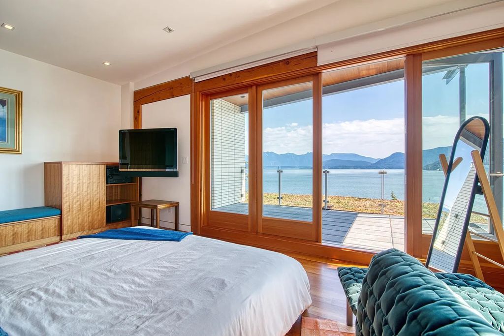 The Estate in Gibsons is a luxurious home offering exceptional privacy with a gorgeous mature landscaping and ocean views now available for sale. This home located at 1012 Marine Dr, Gibsons, BC V0N 1V1, Canada; offering 03 bedrooms and 04 bathrooms with 3,944 square feet of living spaces.