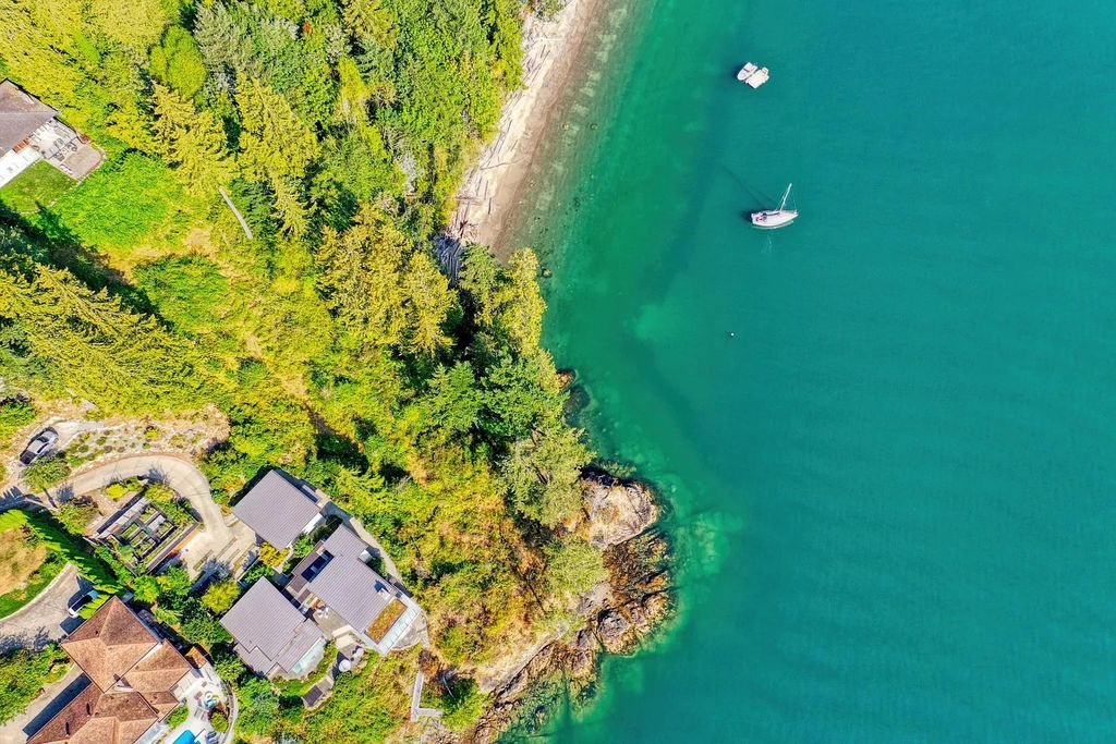 The Estate in Gibsons is a luxurious home offering exceptional privacy with a gorgeous mature landscaping and ocean views now available for sale. This home located at 1012 Marine Dr, Gibsons, BC V0N 1V1, Canada; offering 03 bedrooms and 04 bathrooms with 3,944 square feet of living spaces.