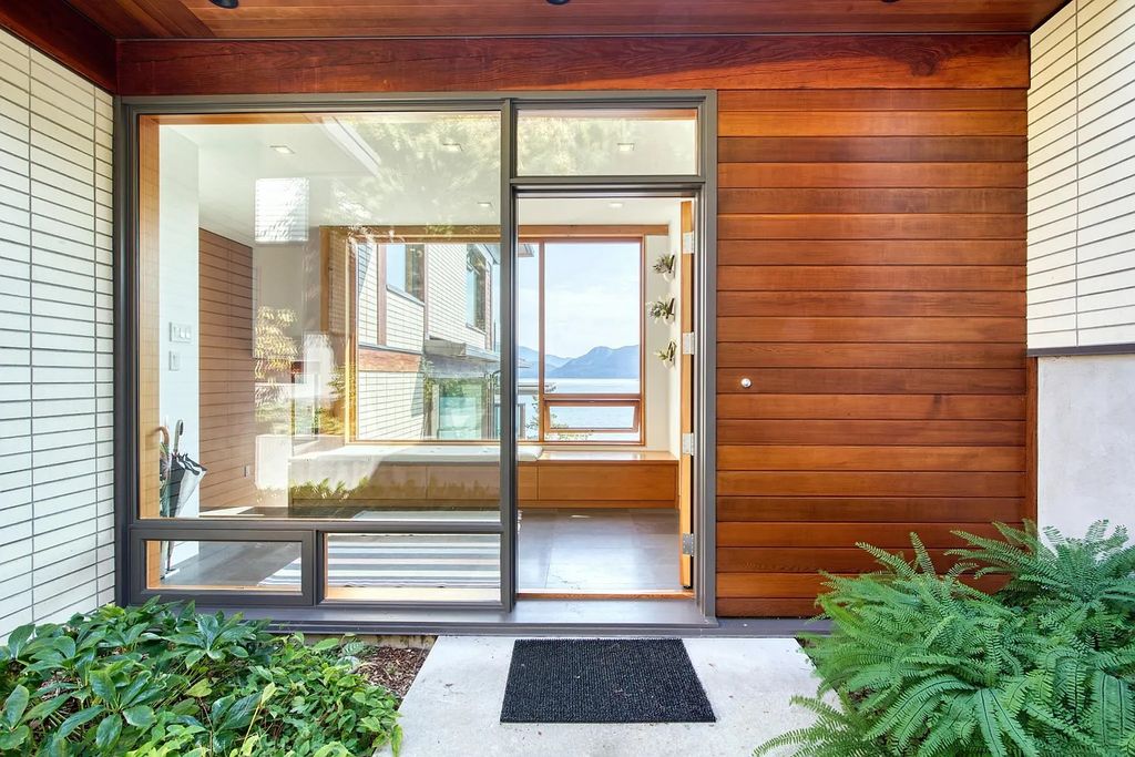 The Estate in Gibsons is a luxurious home offering exceptional privacy with a gorgeous mature landscaping and ocean views now available for sale. This home located at 1012 Marine Dr, Gibsons, BC V0N 1V1, Canada; offering 03 bedrooms and 04 bathrooms with 3,944 square feet of living spaces.