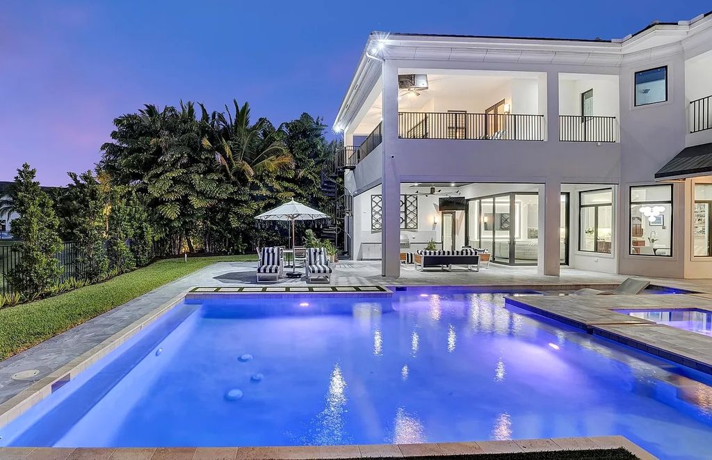 16825 Matisse Drive, Delray Beach, Florida is a beautiful resort style home comes with modern floor plan, winding wood staircase, a media room, wet bar & gaming area, summer kitchen, putting green, retractable doors, and more. 