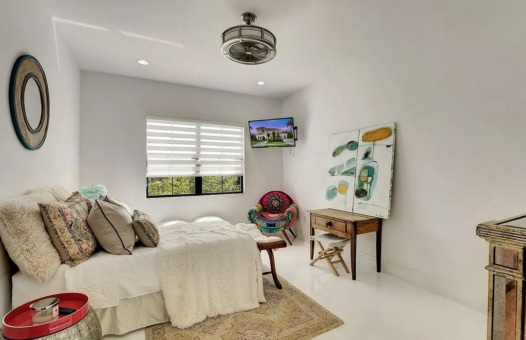 16825 Matisse Drive, Delray Beach, Florida is a beautiful resort style home comes with modern floor plan, winding wood staircase, a media room, wet bar & gaming area, summer kitchen, putting green, retractable doors, and more. 