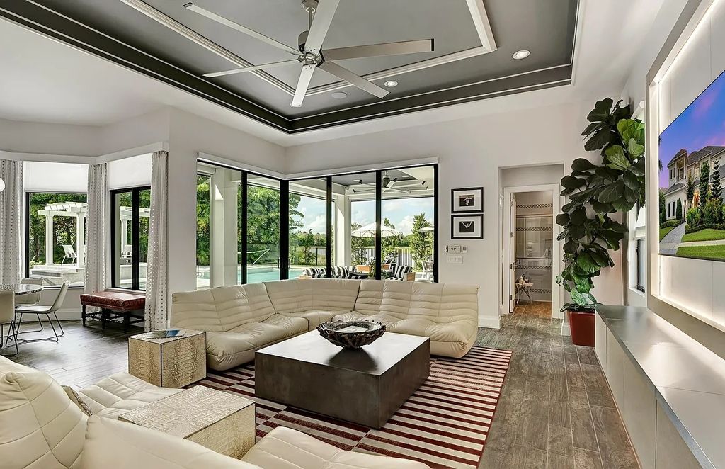 16825 Matisse Drive, Delray Beach, Florida is a beautiful resort style home comes with modern floor plan, winding wood staircase, a media room, wet bar & gaming area, summer kitchen, putting green, retractable doors, and more. 