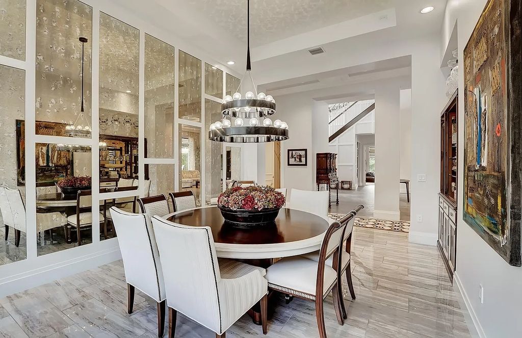 16825 Matisse Drive, Delray Beach, Florida is a beautiful resort style home comes with modern floor plan, winding wood staircase, a media room, wet bar & gaming area, summer kitchen, putting green, retractable doors, and more. 