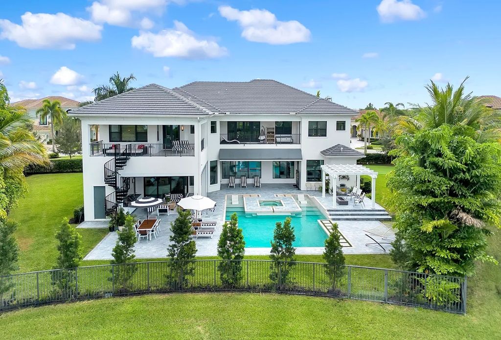 16825 Matisse Drive, Delray Beach, Florida is a beautiful resort style home comes with modern floor plan, winding wood staircase, a media room, wet bar & gaming area, summer kitchen, putting green, retractable doors, and more. 