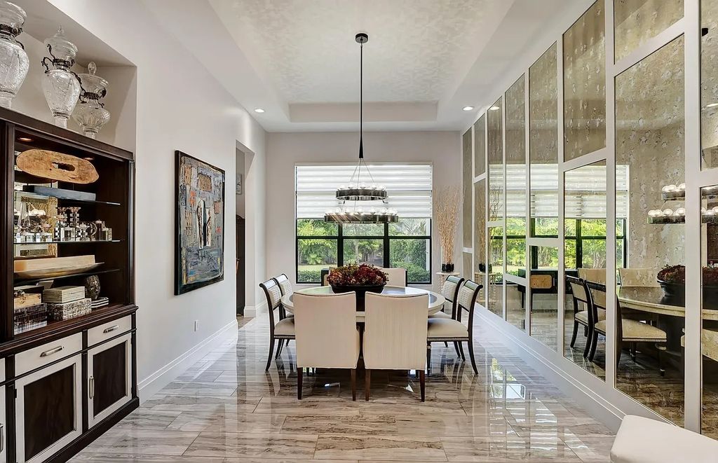 16825 Matisse Drive, Delray Beach, Florida is a beautiful resort style home comes with modern floor plan, winding wood staircase, a media room, wet bar & gaming area, summer kitchen, putting green, retractable doors, and more. 