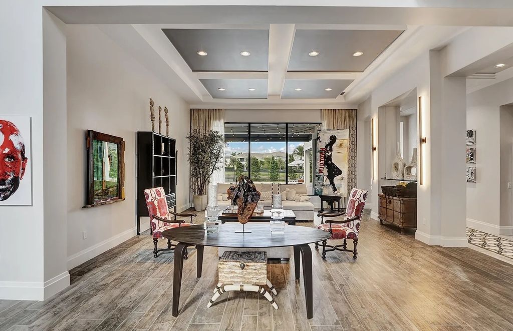16825 Matisse Drive, Delray Beach, Florida is a beautiful resort style home comes with modern floor plan, winding wood staircase, a media room, wet bar & gaming area, summer kitchen, putting green, retractable doors, and more. 