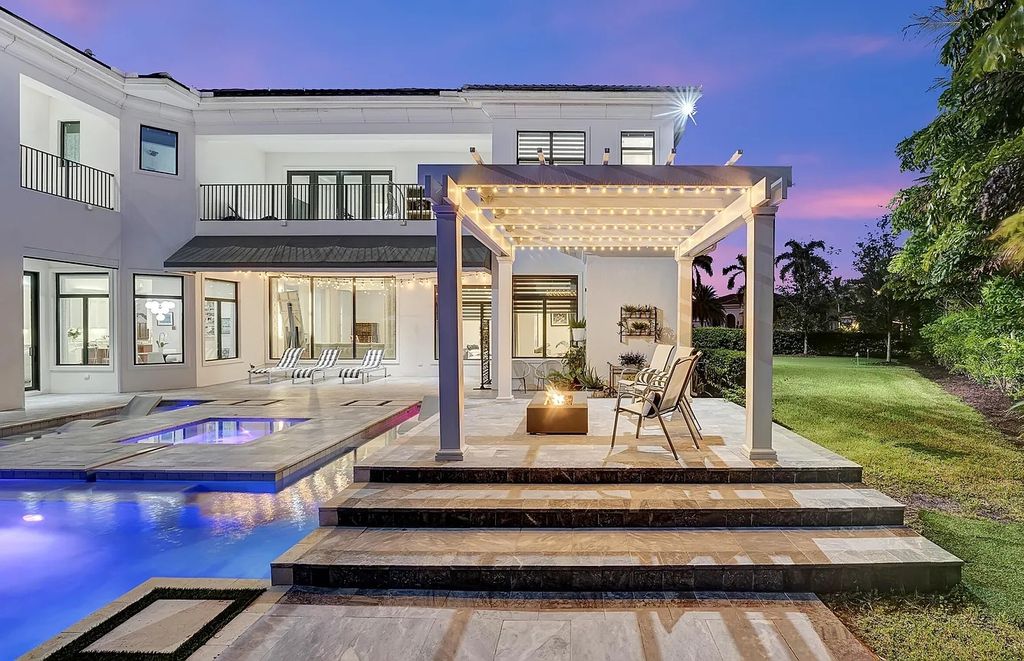 16825 Matisse Drive, Delray Beach, Florida is a beautiful resort style home comes with modern floor plan, winding wood staircase, a media room, wet bar & gaming area, summer kitchen, putting green, retractable doors, and more. 