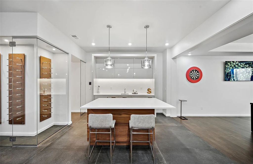 The Home in Denver, a refined modern luxury estate with many upgrades have been added inside and out including sparkling chandeliers, floating staircase and many other architectural details is now available for sale. This home located at 2464 S Adams Street, Denver, Colorado
