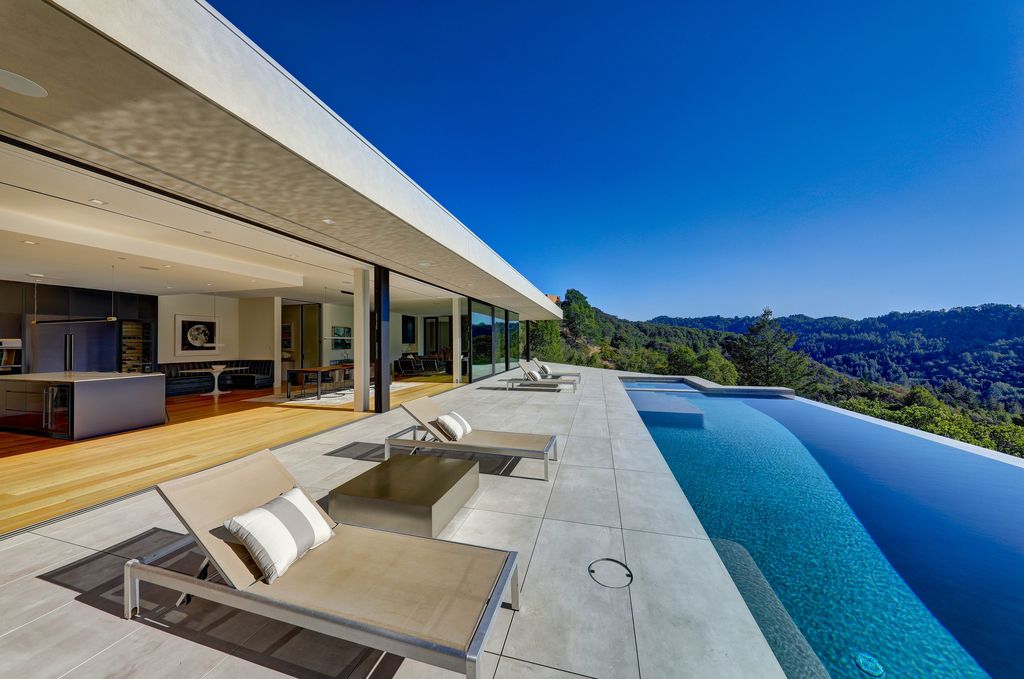 70 Ridgecrest Road, Kentfield, California is an architectural work of art on one of Marin County's most coveted sites with features include infinity edge pool, in ground spa, state of the art outdoor kitchen, fire pit, multiple lounging areas.