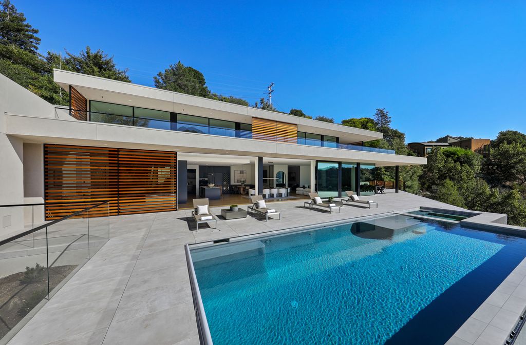 70 Ridgecrest Road, Kentfield, California is an architectural work of art on one of Marin County's most coveted sites with features include infinity edge pool, in ground spa, state of the art outdoor kitchen, fire pit, multiple lounging areas.