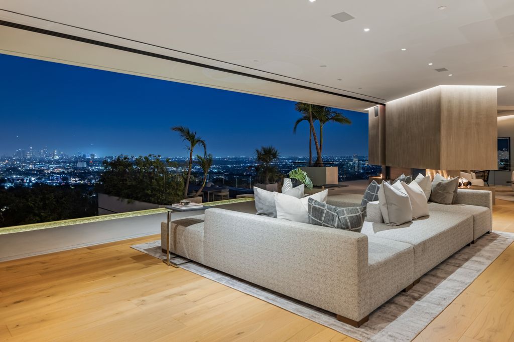 7869 Fareholm Drive, Los Angeles, California is a stunning home soars over the city lights with breathtaking views spanning from downtown Los Angeles to the Pacific Ocean. 