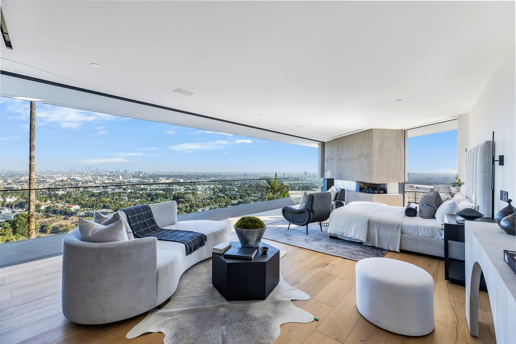 7869 Fareholm Drive, Los Angeles, California is a stunning home soars over the city lights with breathtaking views spanning from downtown Los Angeles to the Pacific Ocean. 