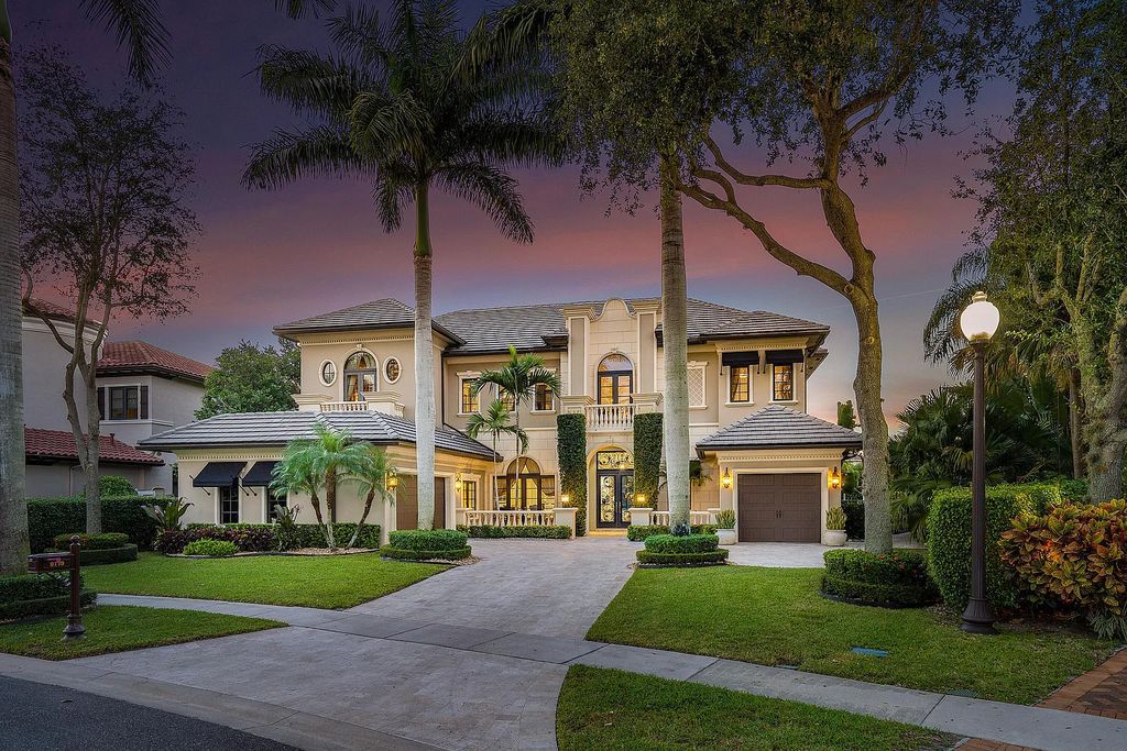 9179 Redonda Drive, Boca Raton, Florida is a custom lakefront Chateau in the prestigious Sanctuary section of The Oaks set on a special expansive lot with endless long lake views. 