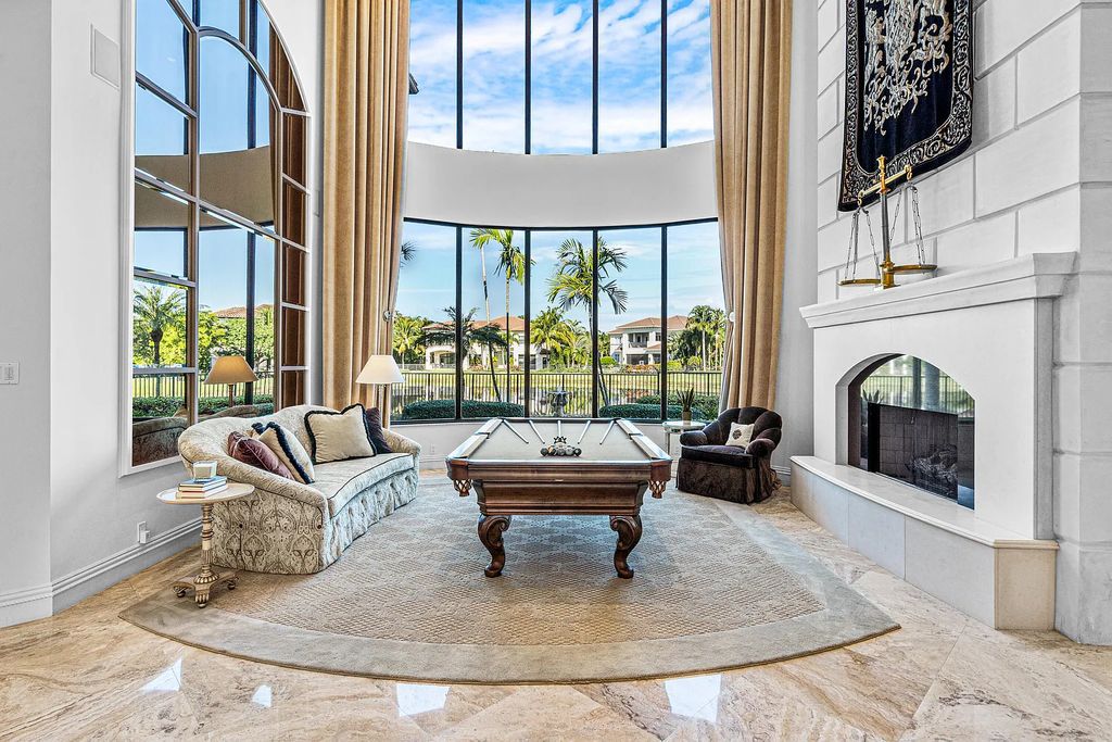 9179 Redonda Drive, Boca Raton, Florida is a custom lakefront Chateau in the prestigious Sanctuary section of The Oaks set on a special expansive lot with endless long lake views. 