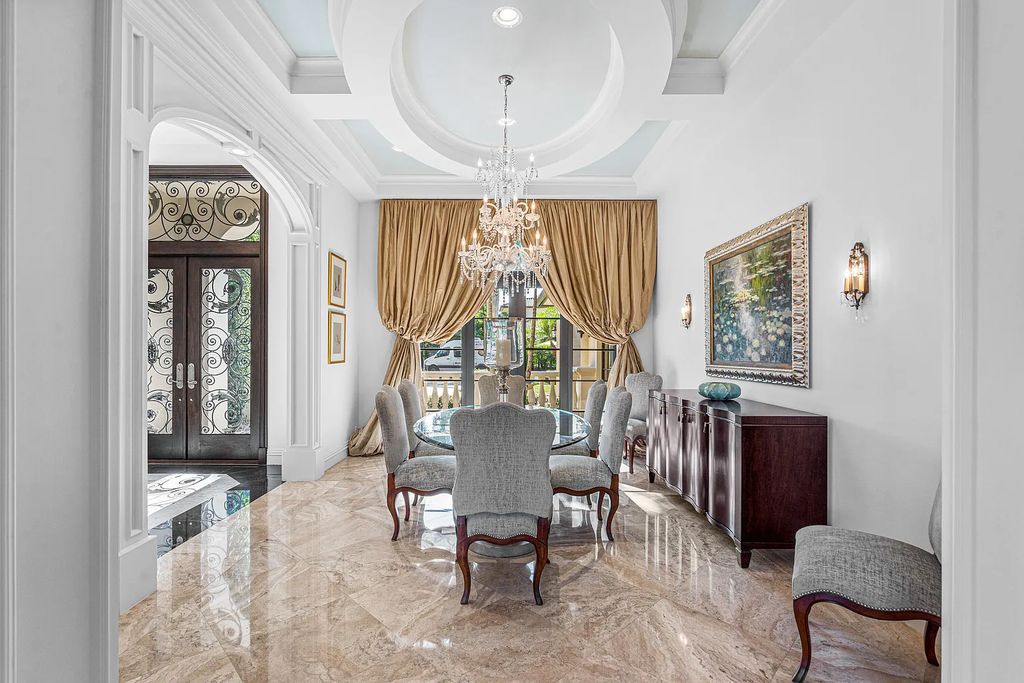 9179 Redonda Drive, Boca Raton, Florida is a custom lakefront Chateau in the prestigious Sanctuary section of The Oaks set on a special expansive lot with endless long lake views. 