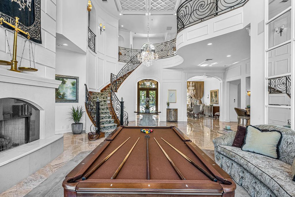 9179 Redonda Drive, Boca Raton, Florida is a custom lakefront Chateau in the prestigious Sanctuary section of The Oaks set on a special expansive lot with endless long lake views. 