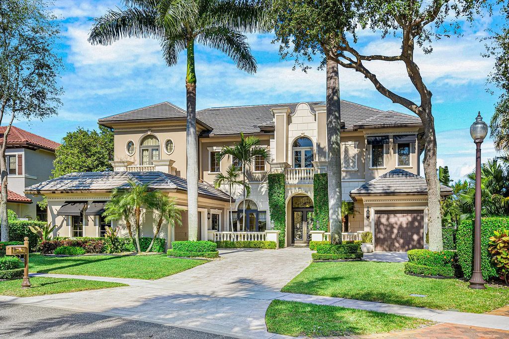 9179 Redonda Drive, Boca Raton, Florida is a custom lakefront Chateau in the prestigious Sanctuary section of The Oaks set on a special expansive lot with endless long lake views. 