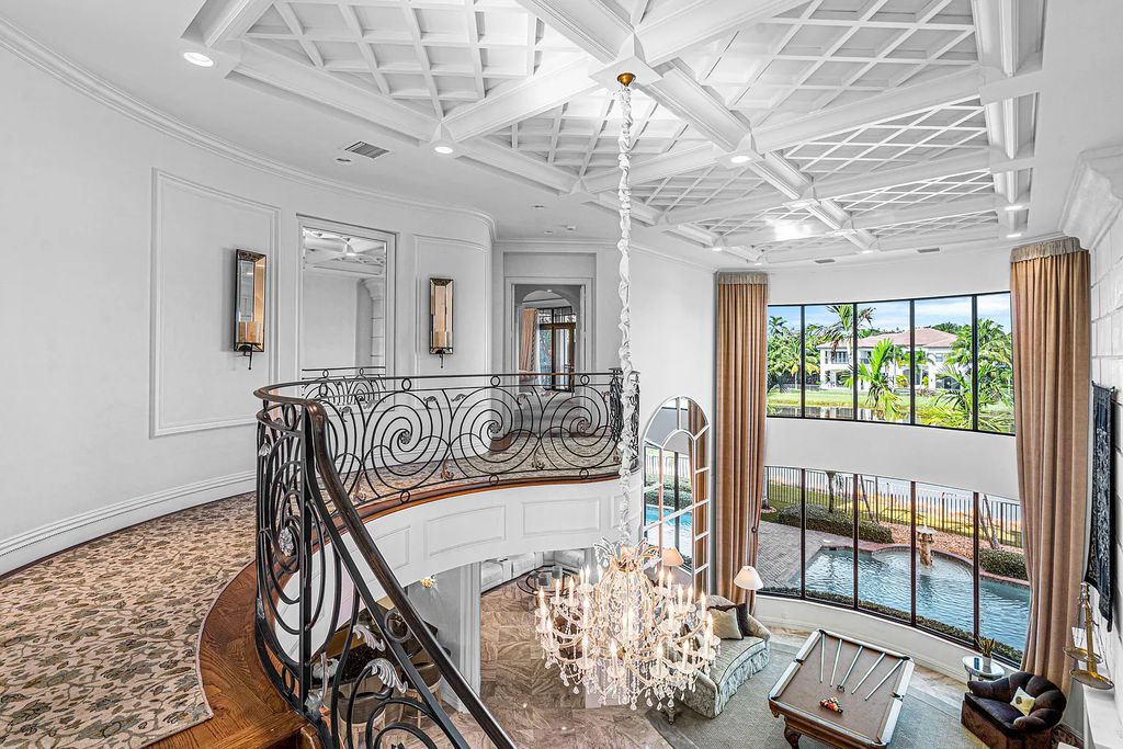9179 Redonda Drive, Boca Raton, Florida is a custom lakefront Chateau in the prestigious Sanctuary section of The Oaks set on a special expansive lot with endless long lake views. 