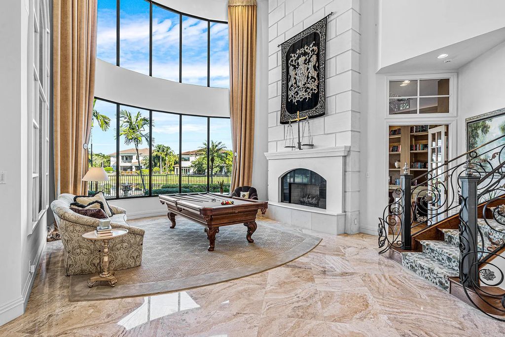 9179 Redonda Drive, Boca Raton, Florida is a custom lakefront Chateau in the prestigious Sanctuary section of The Oaks set on a special expansive lot with endless long lake views. 