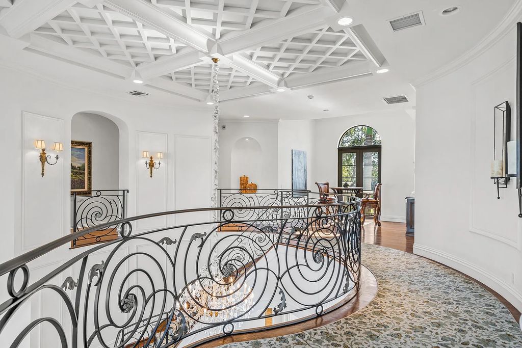 9179 Redonda Drive, Boca Raton, Florida is a custom lakefront Chateau in the prestigious Sanctuary section of The Oaks set on a special expansive lot with endless long lake views. 