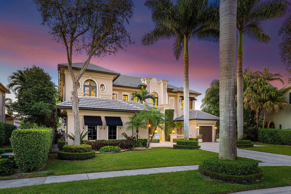 9179 Redonda Drive, Boca Raton, Florida is a custom lakefront Chateau in the prestigious Sanctuary section of The Oaks set on a special expansive lot with endless long lake views. 