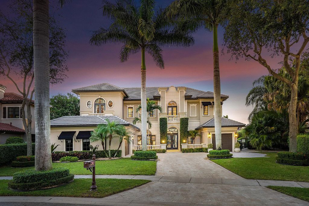 9179 Redonda Drive, Boca Raton, Florida is a custom lakefront Chateau in the prestigious Sanctuary section of The Oaks set on a special expansive lot with endless long lake views. 