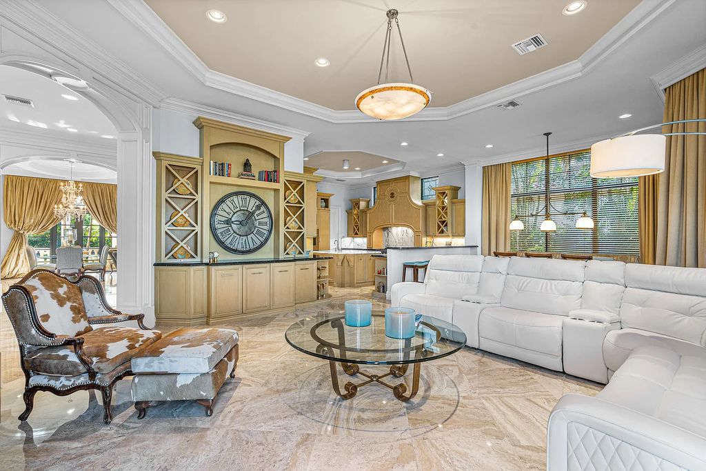 9179 Redonda Drive, Boca Raton, Florida is a custom lakefront Chateau in the prestigious Sanctuary section of The Oaks set on a special expansive lot with endless long lake views. 