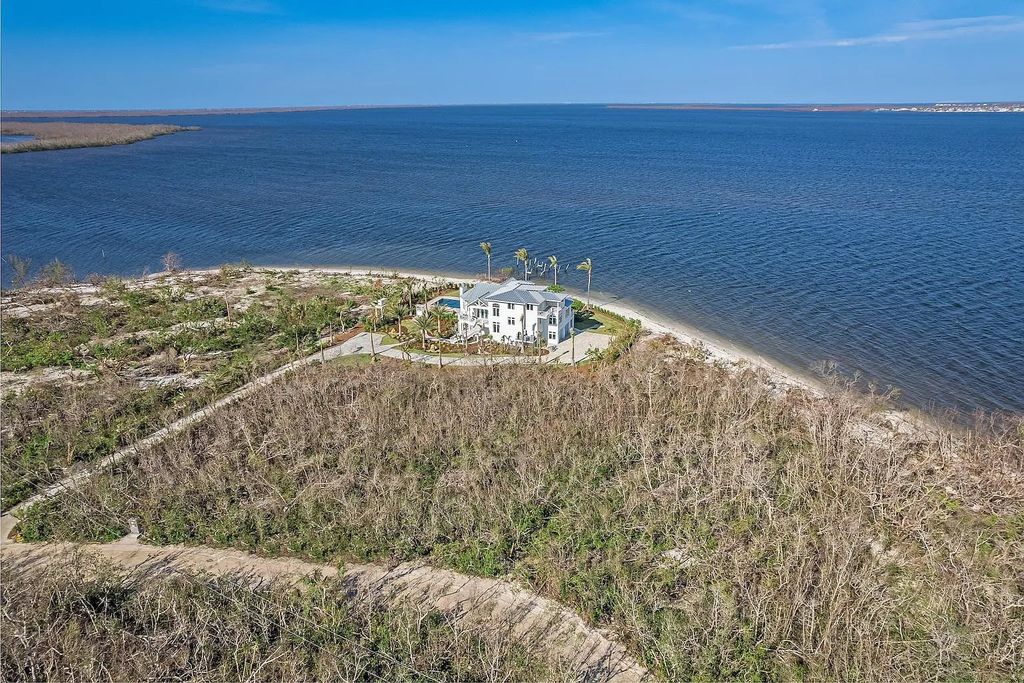 1800 Woodring Road, Sanibel, Florida is a tropical beachfront sits on an iconic location of historical significance on Sanibel Island boasting 165 feet of natural seashell shoreline facing west with unobstructed views across Pine Island Sound.
