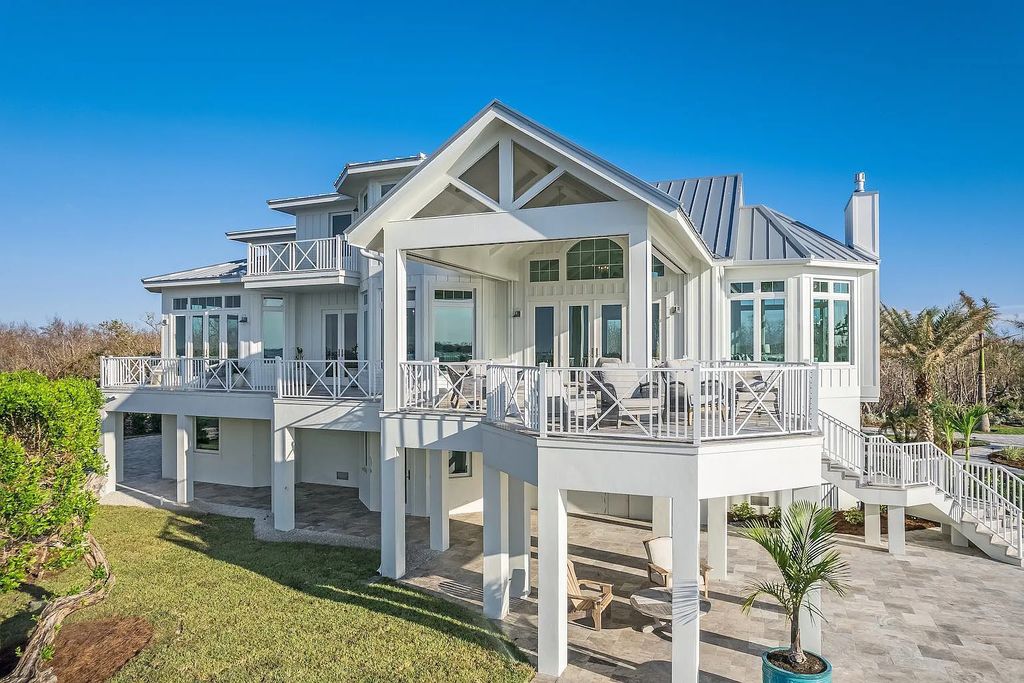 1800 Woodring Road, Sanibel, Florida is a tropical beachfront sits on an iconic location of historical significance on Sanibel Island boasting 165 feet of natural seashell shoreline facing west with unobstructed views across Pine Island Sound.
