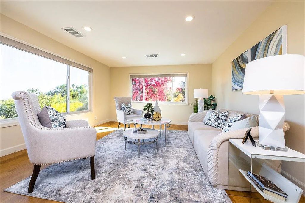 20901 Michaels Drive, Saratoga, California is a modern East facing home with divine sunrise views, city light night views sitting on a peaceful, quiet, location full of nature and still close to town; restaurants, parks, library, schools & more. 