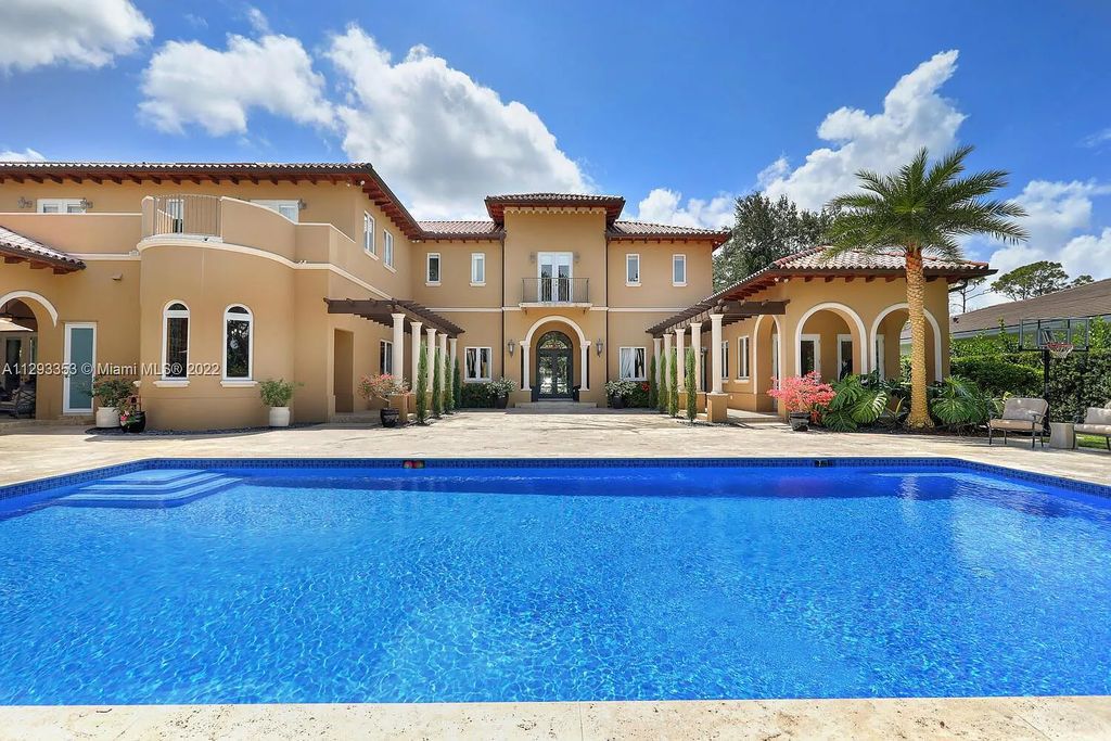 6701 SW 72nd Court, Miami, Florida is a Mediterranean Masterpiece with private electronic gates boasts top-of-the-line finishes and professionally designed landscaping perfect for entertaining.