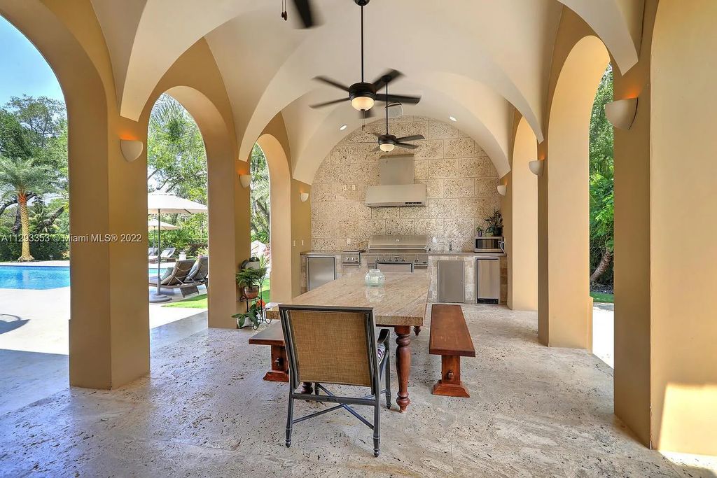 6701 SW 72nd Court, Miami, Florida is a Mediterranean Masterpiece with private electronic gates boasts top-of-the-line finishes and professionally designed landscaping perfect for entertaining.