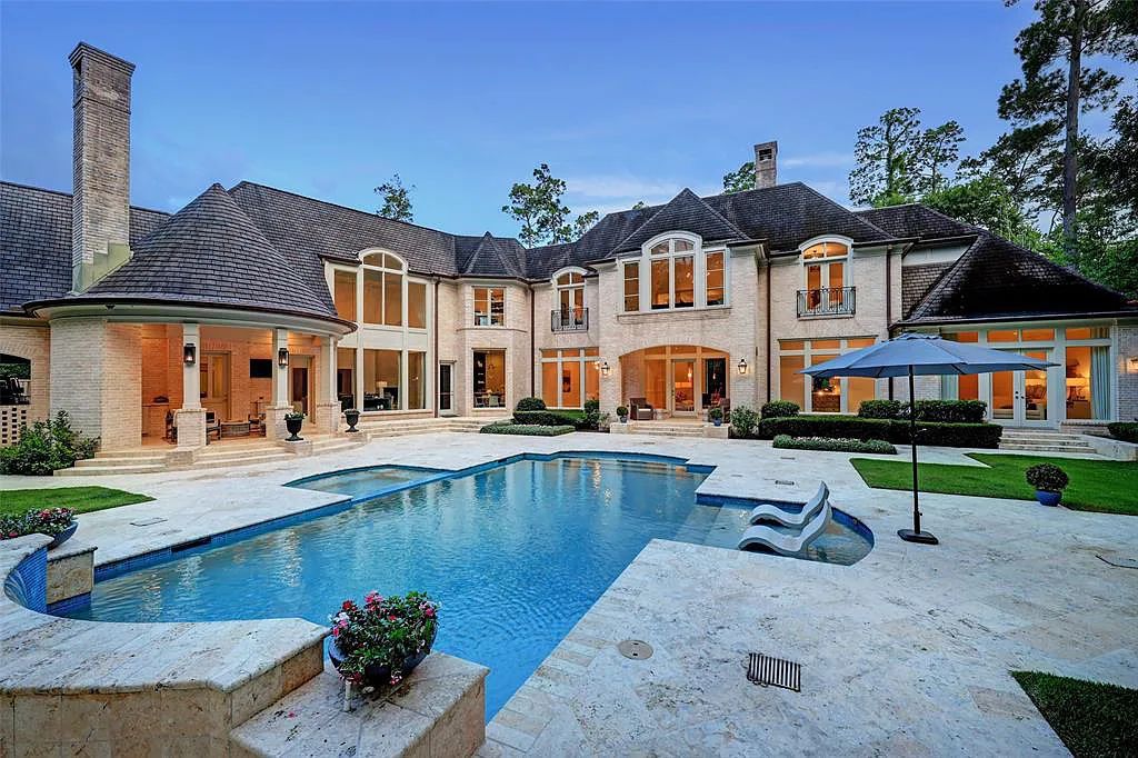 11526 Shadow Way Street, Houston, Texas is an exceptional gated property with spectacular living areas and dining room overlook to serene setting and pool, sophisticated interiors featuring a series of luminous open spaces. 