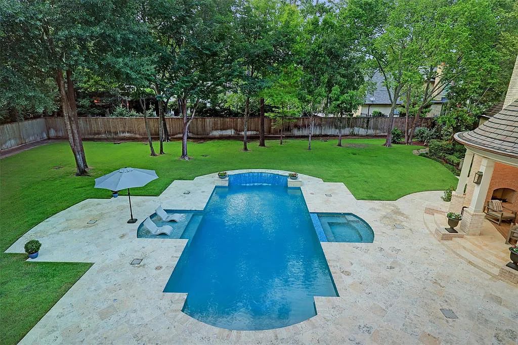 11526 Shadow Way Street, Houston, Texas is an exceptional gated property with spectacular living areas and dining room overlook to serene setting and pool, sophisticated interiors featuring a series of luminous open spaces. 