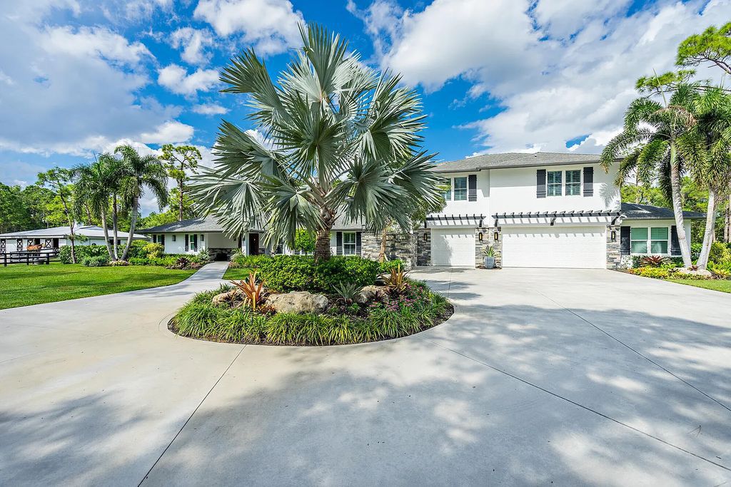14165 Banded Racoon Drive, Palm Beach Gardens, Florida is an exquisite residence perfectly proportioned usable five acres with a breath of fresh air to equestrian architecture and design.