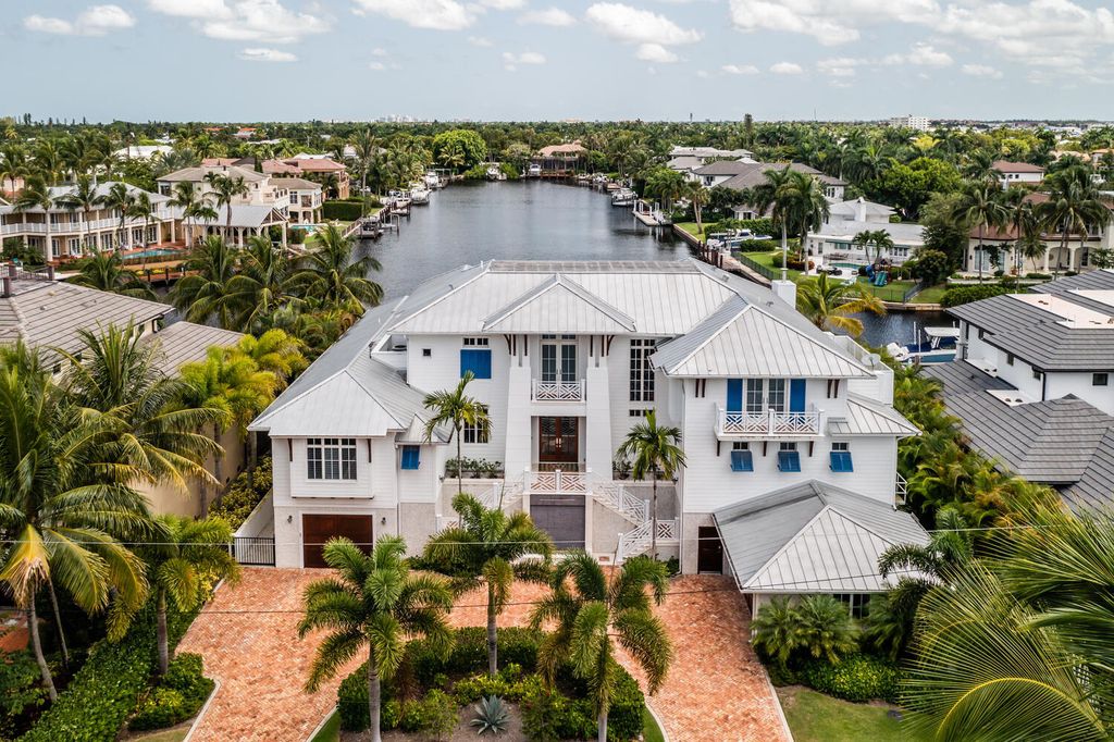 481 21st Ave S, Naples, Florida is a one-of-a-kind estate nestled along the widest canal in Aqualane Shore with hardwood flooring, shiplap siding and outstanding finishes, enhanced by mesmerizing water views.