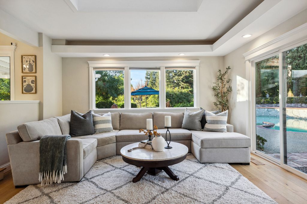1941 Parkmont Drive, Alamo, California is beautiful remodeled custom home features a resort-like backyard with pool, spa, outdoor kitchen, built-in fire pit, bocce court, expansive level grassy area to play, sport court location, producing vineyard, vegetable garden beds, & fruit trees.