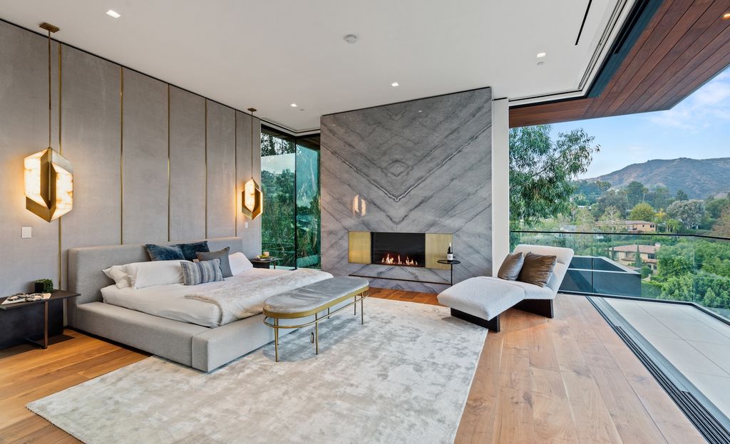 1130 Angelo Drive, Beverly Hills, California is a stunning 2022 new organic architectural gem set in the most desirable zip code in the world showcases sweeping views of Downtown Los Angeles and Century City.