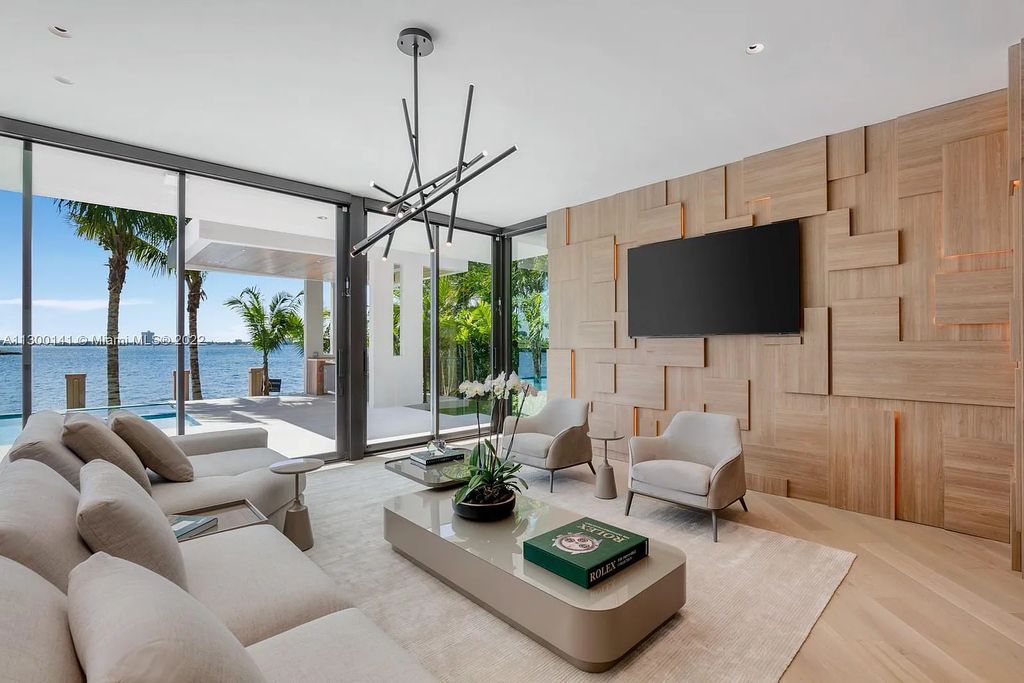 9530 W Broadview Drive, Bay Harbor Islands, Florida is a tropical modern masterpiece with architecture by Choeff Levy Fischman, interior design by CBDesign, developed by Gamma Construction, evokes the essence of Miami Beach sophistication.