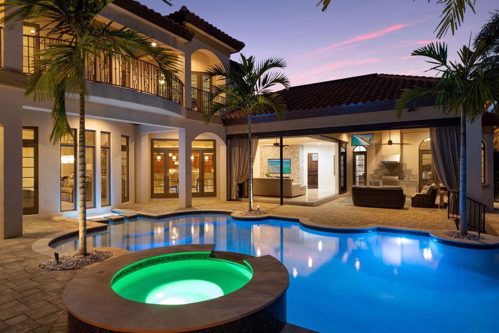 2539 Escada Court, Naples, Florida is a custom-built estate just minutes to world class beaches, shopping and fine dining with picturesque pool and lake views from just about every room.