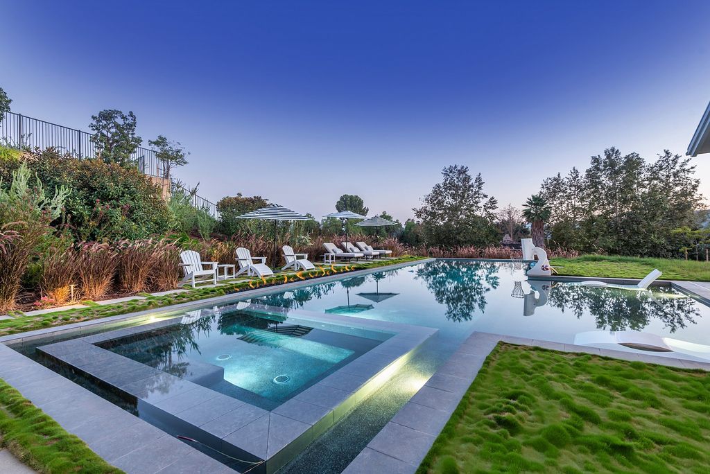 1781 Miller Ranch Drive, Thousand Oaks, California is an epic single story estate with resort quality grounds are simply perfect boasting a full sized basketball court, custom pool and spa.