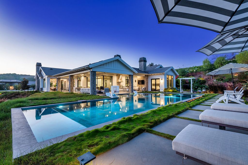 1781 Miller Ranch Drive, Thousand Oaks, California is an epic single story estate with resort quality grounds are simply perfect boasting a full sized basketball court, custom pool and spa.