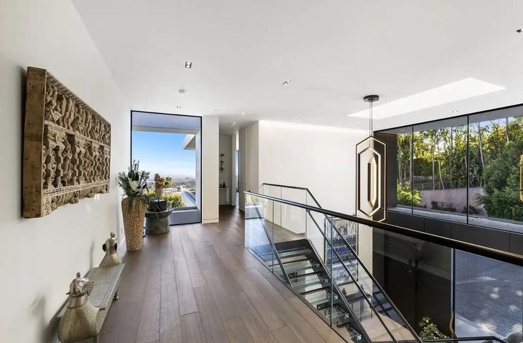 1320 Beverly Grove Place, Beverly Hills, California is an exceptional modern estate was crafted with a seamless indoor outdoor lifestyle and a focus on light, open spaces, and breathtaking views. 