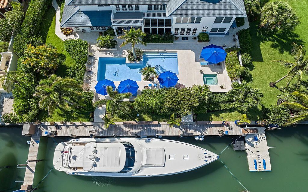 6819 SE South Marina Way, Stuart, Florida is a dream property in a guard gated oceanfront community Sailfish Point with dockage to accommodate an 80ft yacht and just minutes to the inlet and ocean.