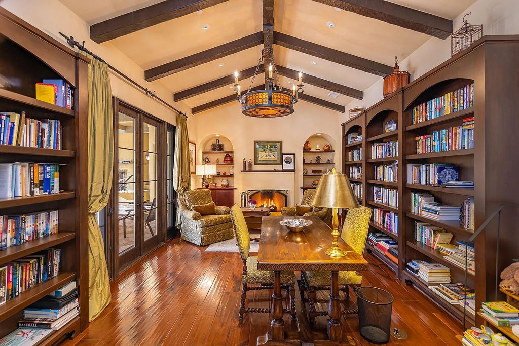 561 Saddle Lane, Ojai, California is a majestic Mediterranean-style home has flowing curves, arched doorways, and cathedral ceilings with exposed hand-hewn beams and clerestory windows.