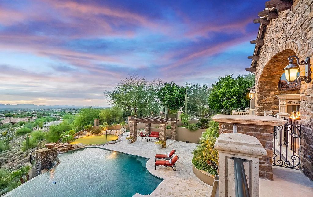 14371 E Kalil Drive, Scottsdale, Arizona is a custom home with captivating views situated on almost an acre in a private gated enclave just minutes from Scottsdale's renowned golf, restaurant, and shopping.