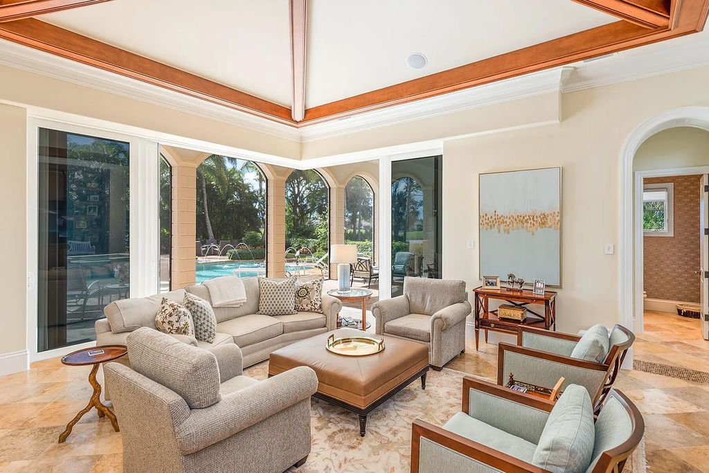3855 Isla Del Sol Way, Naples, Florida is an impressive in the award-winning community of Fiddler's Creek with a breathtaking view of the pool, lake, and golf course.