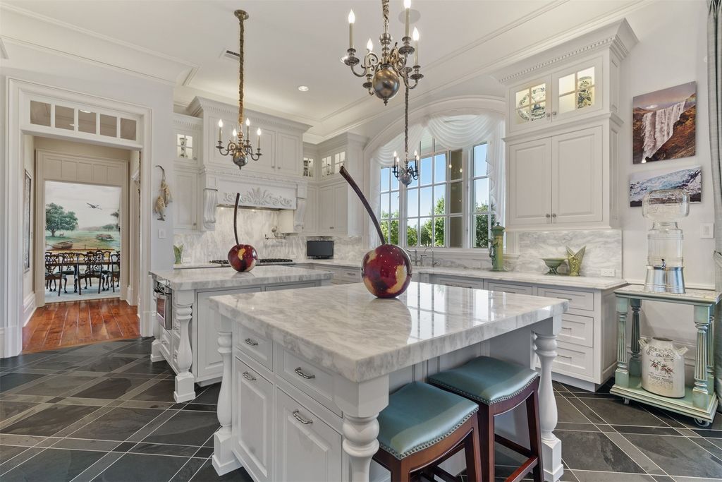 38 E Shore Drive, The Woodlands, Texas is a Southern French Colonial estate ideally situated on an acre corner lot has attributes and features that distinguish it from the finest real estate in The Woodlands.