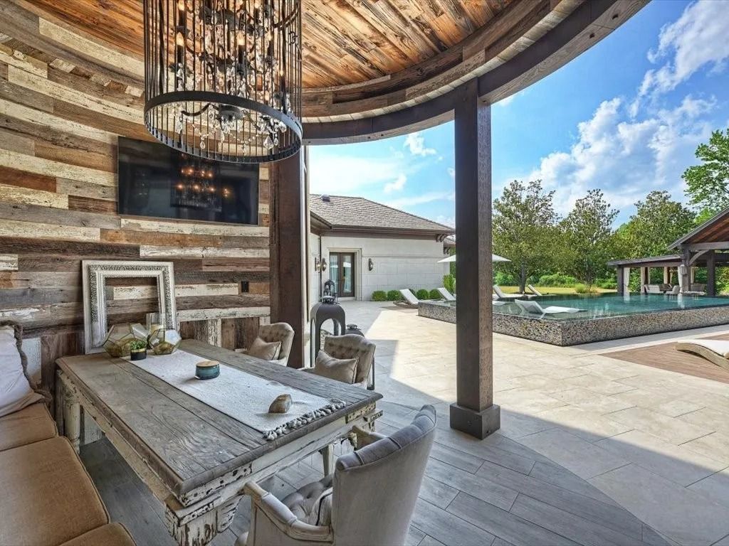The Estate in Mooresville is a luxurious home with an amazing outdoor entertainment area including vanishing edge upper pool, pool house/cabana, now available for sale. This home located at 355 Pelham Ln, Mooresville, North Carolina