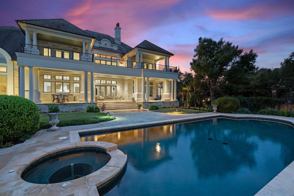 208 Bella Riva Drive, Austin, Texas seated on a well-manicured acre lot with complete privacy and lake views in the coveted gated community of Costa Bella on Lake Travis boasting timeless, high-quality craftsmanship abounds in every corner.